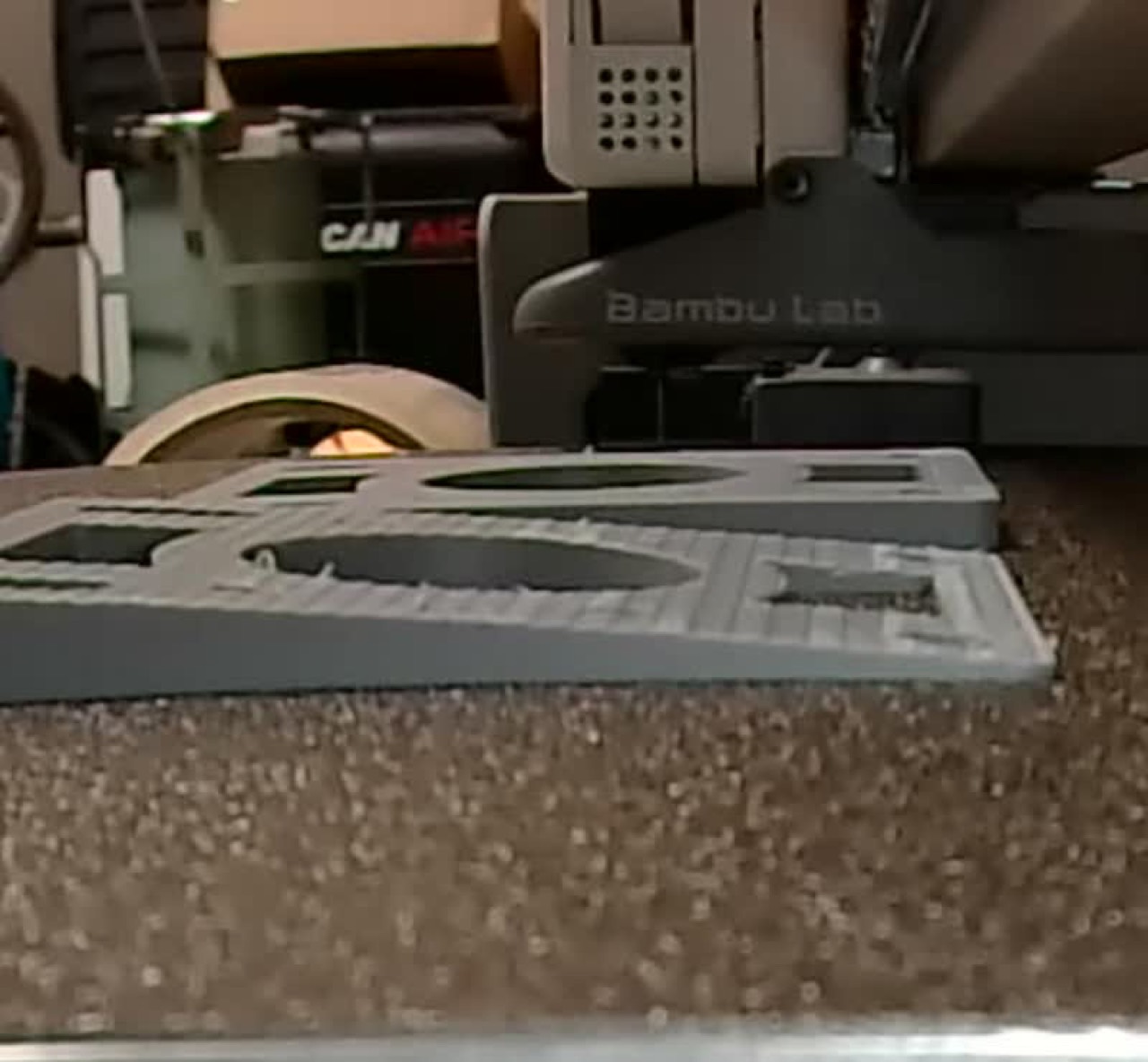 A custom riser pad 3D-printed on a Bambu Lab build plate